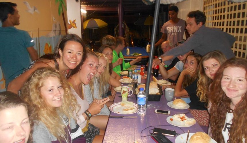 Backpackers having fun together while enjoying their food