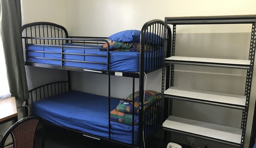 Single twin dorm room with comfortable linen bed
